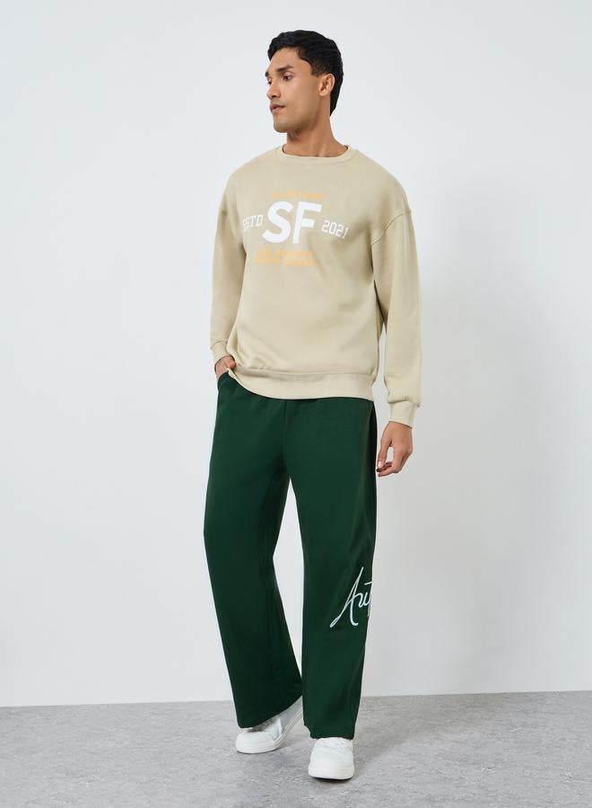 Styli Men Green Embroidered Joggers - Image 1